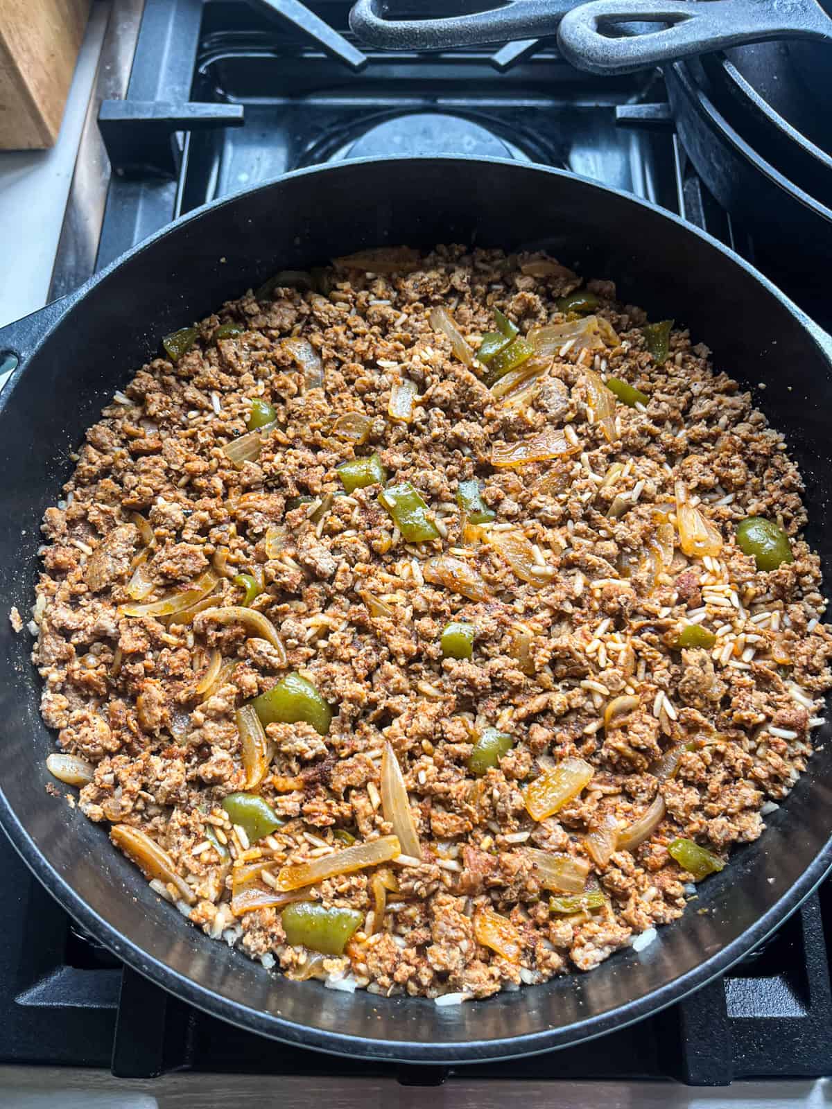 Cooking rice in Cajun rice and sauge skillet.