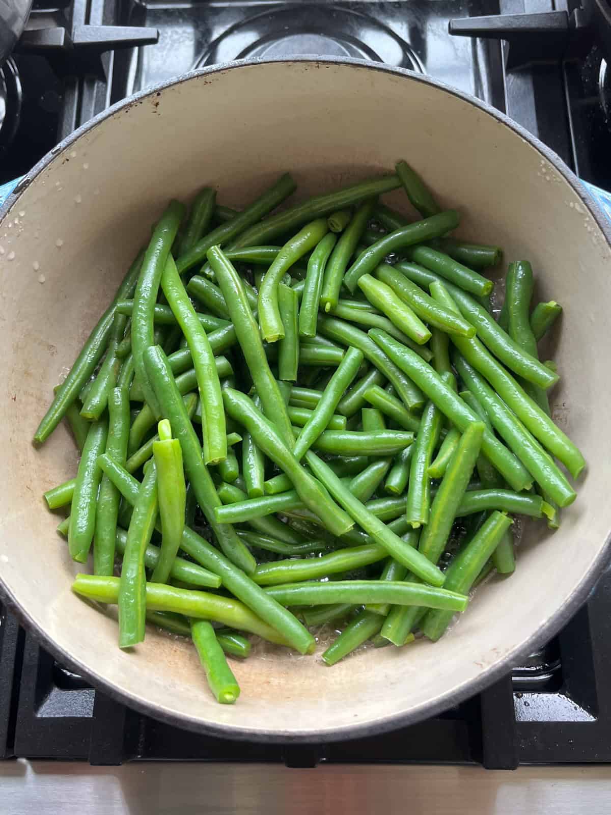 Steamed green beans in a dutch oven.
