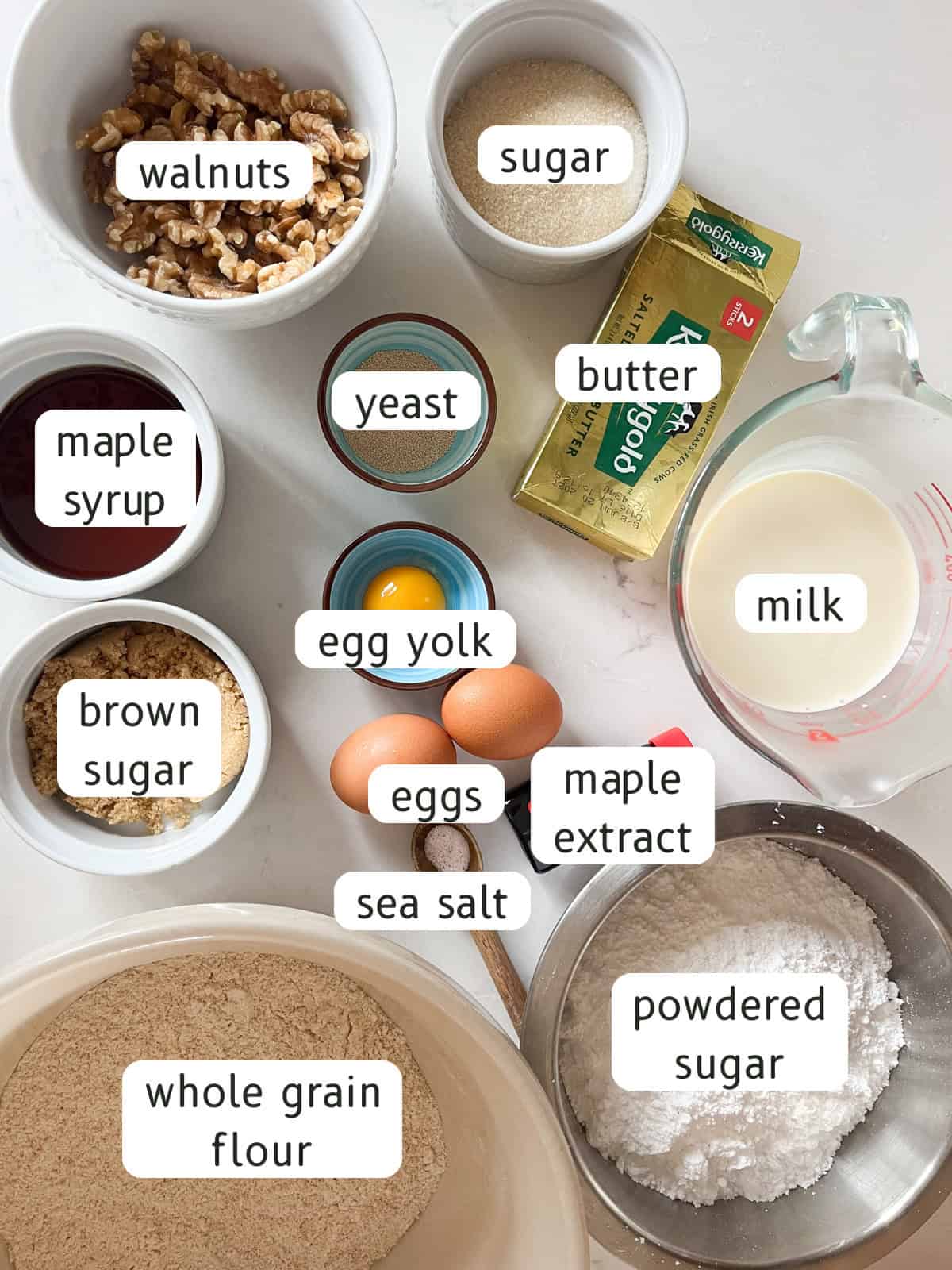 Maple long john donut ingredients on a white kitchen counter.