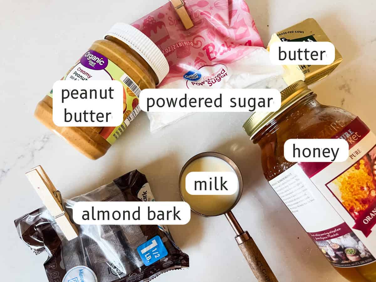 Peanut butter chocolate bars ingredients labeled on a kitchen counter.