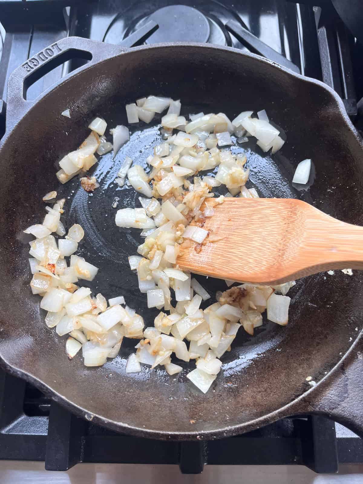 Sauteing onions in a cast iron skillet.