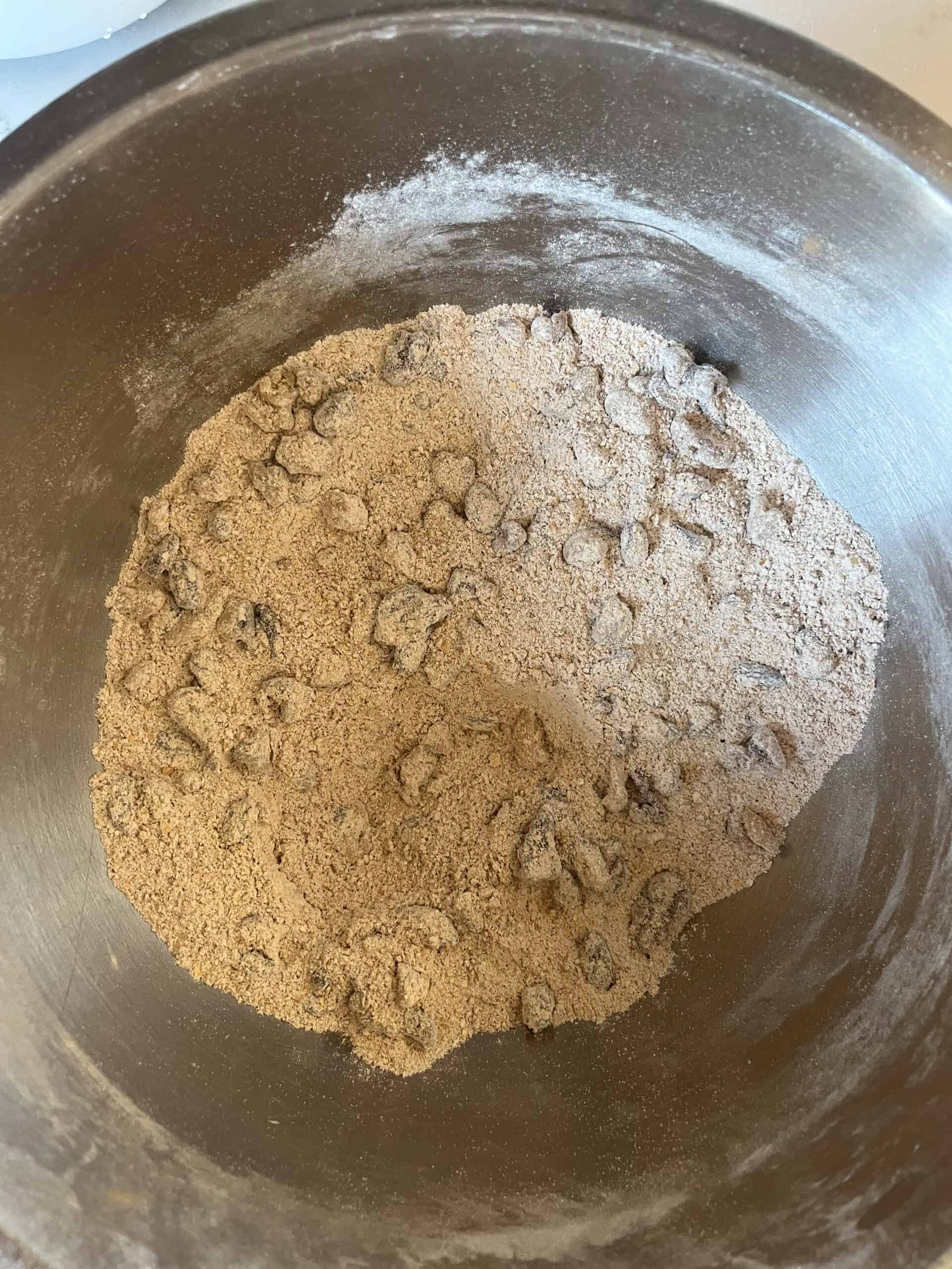 Mixing dry ingredients in a metal bowl.