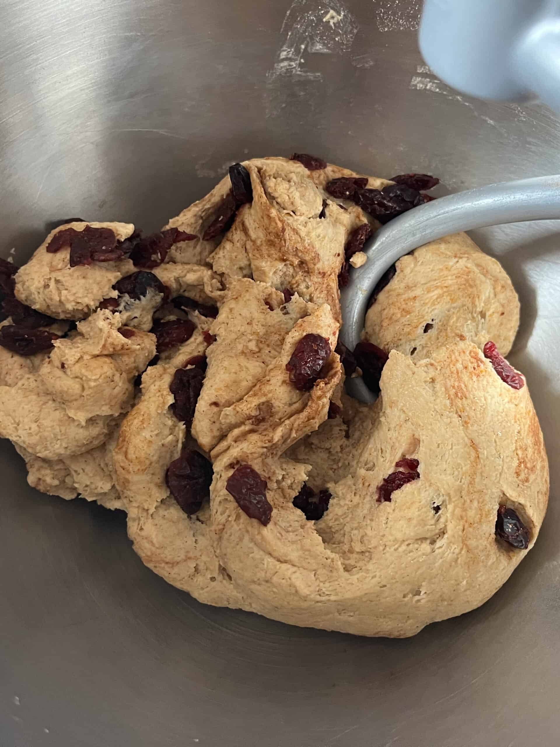 Kneading cranberry bagel dough once the cranberries are added.